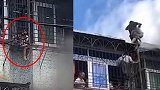 汕头楼房发生火灾 幼童悬挂在窗外拼命挣扎