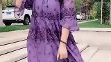 说实话，大姐身上这件紫色的裙子特别像孕妇装