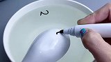 把数字放水里会漂浮起来，孩子多玩几次就记住了