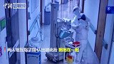 “全副武装”的医护夫妻病房不期而遇 互相拥抱加油打气