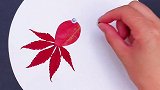 几片树叶做一副超简单的小金鱼树叶贴画