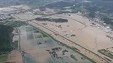 俯拍日本九州暴雨：道路房屋全被淹 积水没胸一片泽国