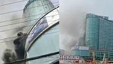 上海一大厦顶楼着火 13辆消防车出动