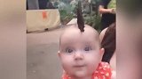 宝宝头上落了一只蝴蝶，怎么都不走，看来很喜欢宝宝呀！