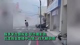 台湾花莲6.9级强震致一建筑倒塌，现场尘土四起，民众尖叫逃生
