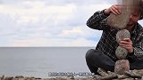 小伙挑战万有引力，将不规则的石头叠在一起，出现了神奇的一幕