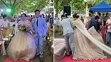 菲律宾：一婚礼策划师藏在新娘婚纱下面，帮她整理裙子方便行走
