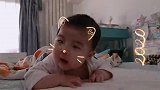 小宝宝练习抬头真的是越来越稳，接下来的表情好可爱，不愧是萌娃