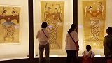 《伏羲女娲图绢画》是吐鲁番阿斯塔那墓出土的，外籍专家考察研究后声称：它与DNA的双螺旋结构极为吻合考古发现