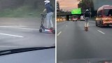 美国：司机拍下男子骑电动滑板车在高速上飙车，时速超过80公里