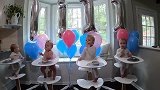 四胞胎一岁啦，排排坐边吃边好奇，看看气球看看人