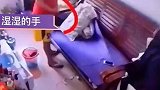 男子用湿手触摸电源，拿充电器给手机充电被电倒