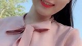 姑娘衣着粉红色上衣真好看！