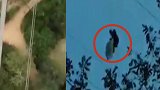 哥伦比亚男子玩滑翔伞被风吹上150米高压线，悬挂8小时终获救