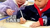 女孩手把手教男生写字，最后相视一笑，这笑容太甜了