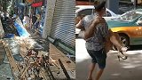 四川南充闹市三家店铺招牌突然掉落砸伤行人 现场一片狼藉