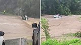 澳大利亚：一司机开车过河遇洪水，眼睁睁看着爱车被冲走
