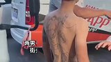两男子街头发生争执，白衣男子咄咄逼人