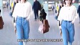 杨紫戴渔夫帽现身上海机场，穿牛仔衣休闲十足，特意与粉丝挥手