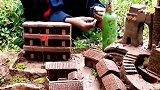 小男孩用泥巴捏出一整个村庄
