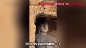 云冈石窟大佛冻得“流鼻涕”，工作人员用镜子反射光给大佛暖鼻子