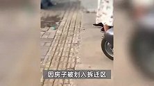 江西抚州多名执法队员当街围殴米粉店店主，官方：打人者已被停职