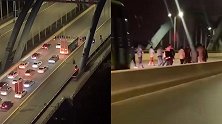 十几人并排压马路堵桥，身后鸣笛声不断仍淡定前行 已交公安处理