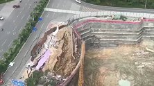 南宁一开裂路面大面积坍塌 大半路面倒向隔壁的建筑工地