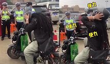 男子头大戴不上头盔 现场演示“难言之隐” 民警笑翻