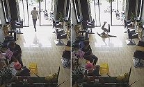 越南：一发廊员工为迎接访客冲出门店，结果撞在玻璃门上反弹倒地