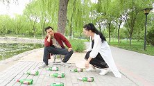 骗局：盆子套酒瓶，套中一个奖100元，来个篮球冠军把骗子整惨