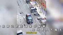 野猪闯入学校旁的街道，被注射两针麻醉无效后，特警果断开枪击毙