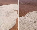 沙特阿拉伯：遭遇极端天气，冰雹汇集成洪水流过沙漠地带