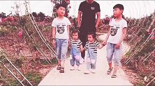 爸爸带着两对双胞胎儿女逛公园，这回头率肯定是百分之百啊
