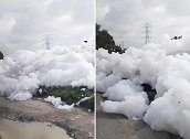 哥伦比亚首都附近河流受污染，河上有毒泡沫被风吹进居民区