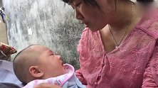 妈妈换了新发型，宝宝看到后想要哭却吓得帽子都掉了