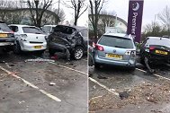 英国一重型卡车失控冲过隔离带 撞坏停车场内17辆汽车