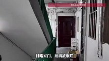 上海一夫妻手持斧头挨家挨户砍门，邻居用木板封死窗户